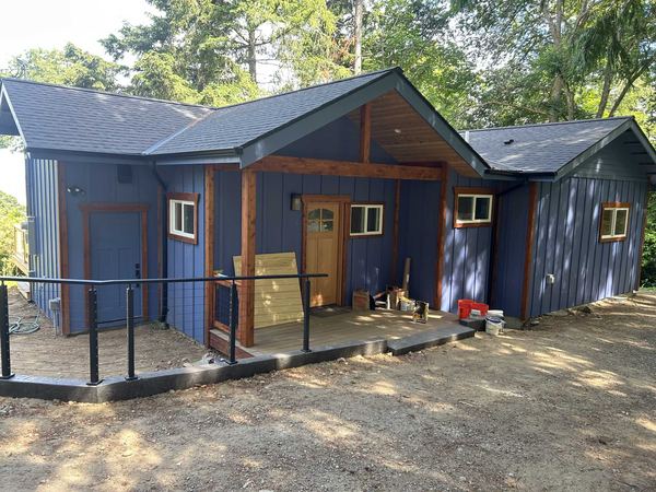 New home construction with blue board-and-batten siding